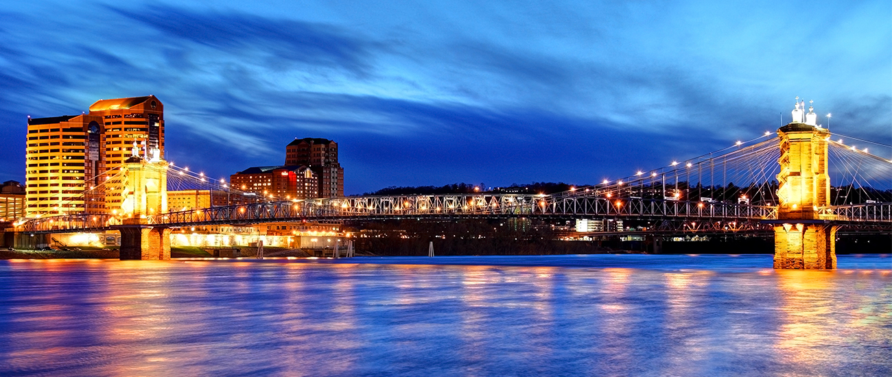 A bridge over a river at dusk